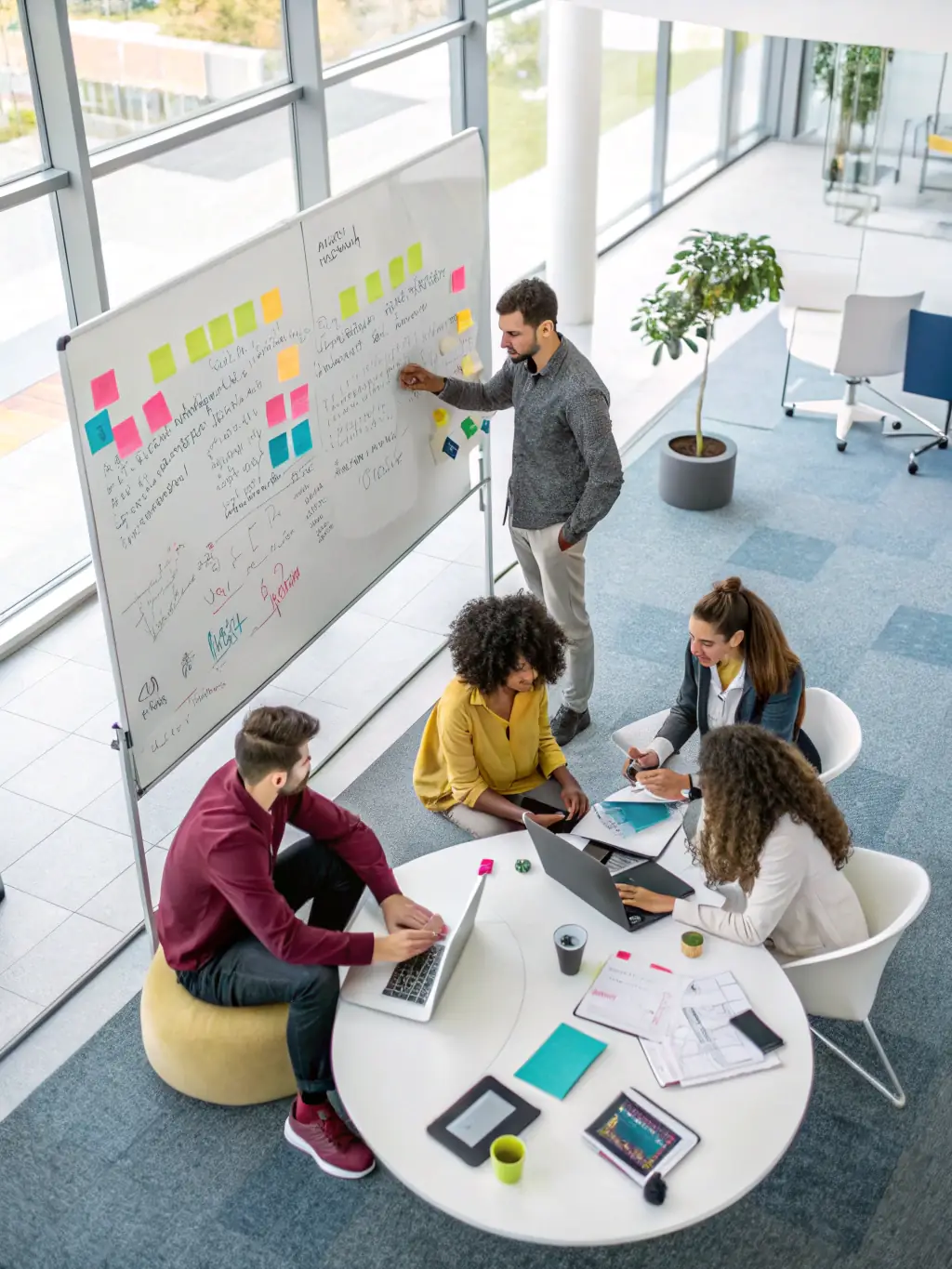 A diverse team of IT consultants collaborating in a modern office setting, brainstorming solutions for a client's pre-sales challenges, showcasing S4B Tech's specialized team formation.